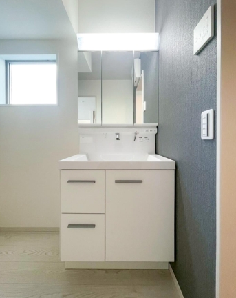 町田市東玉川学園2丁目の新築戸建て1の洗面化粧台の写真