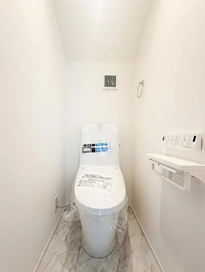 町田市金井1丁目の新築戸建て1のトイレ1Fの写真
