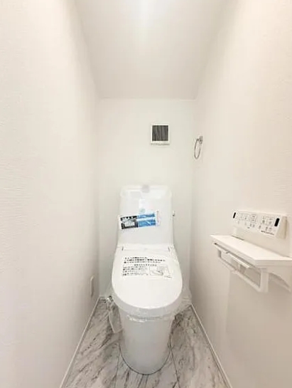 町田市金井1丁目の新築戸建て3のトイレ1Fの写真