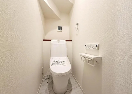 町田市小山町の新築戸建ての7号棟のトイレ1Fの写真