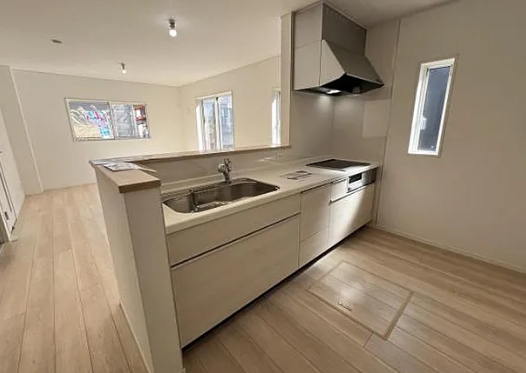 町田市常磐町の新築戸建ての1号棟のキッチンの写真