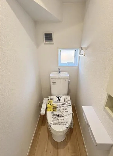 町田市常磐町の新築戸建ての1号棟のトイレ1Fの写真