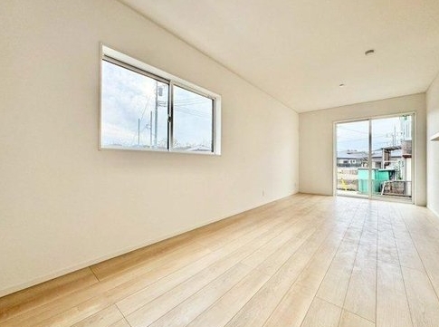 相模原市中央区田名の新築戸建て1号棟のリビングの写真