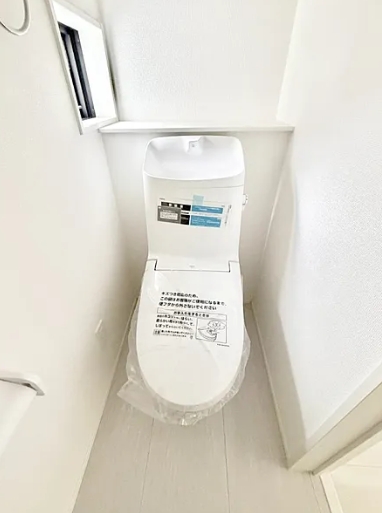 八王子市弐分方町の新築戸建て3号棟のトイレ1fの写真